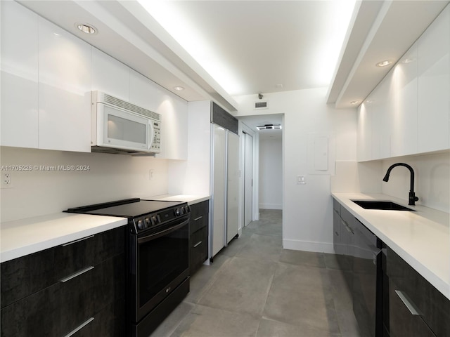 kitchen with white cabinets, dishwasher, black electric range oven, and sink