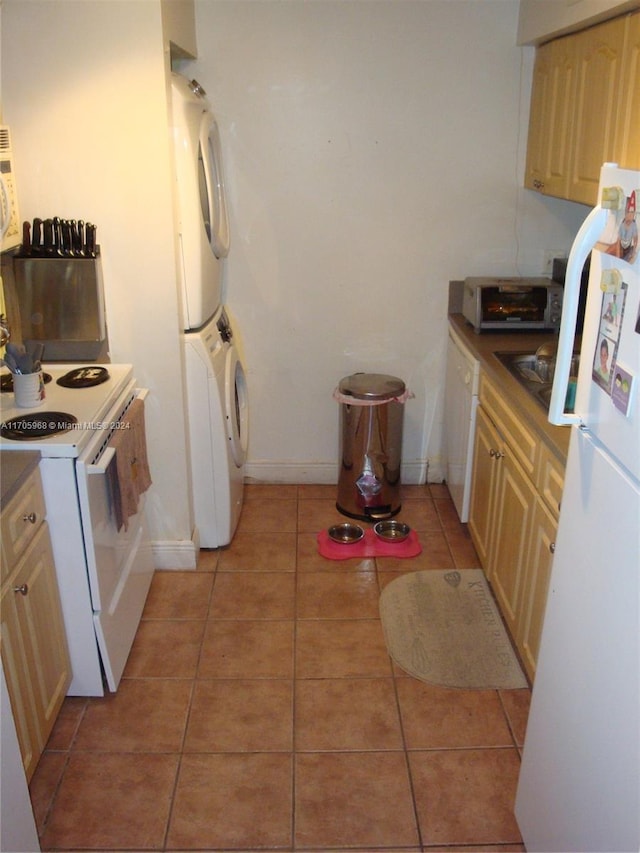 kitchen with stacked washer / dryer, light brown cabinetry, light tile patterned floors, and white appliances