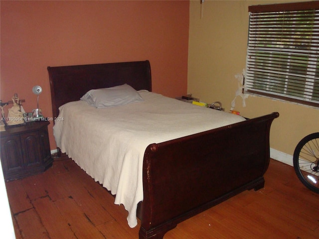 bedroom with wood-type flooring