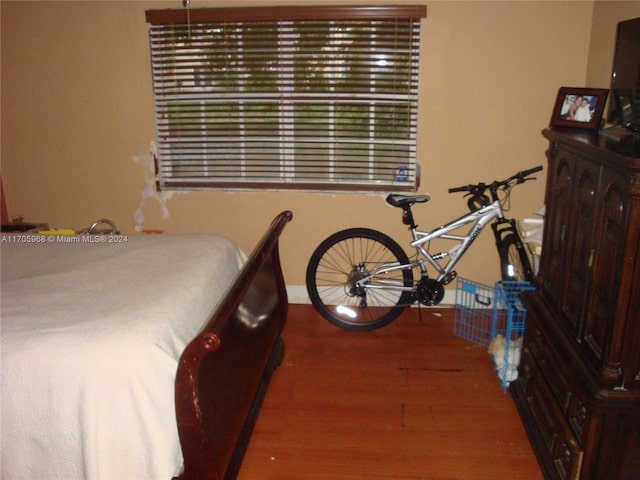 bedroom featuring hardwood / wood-style flooring