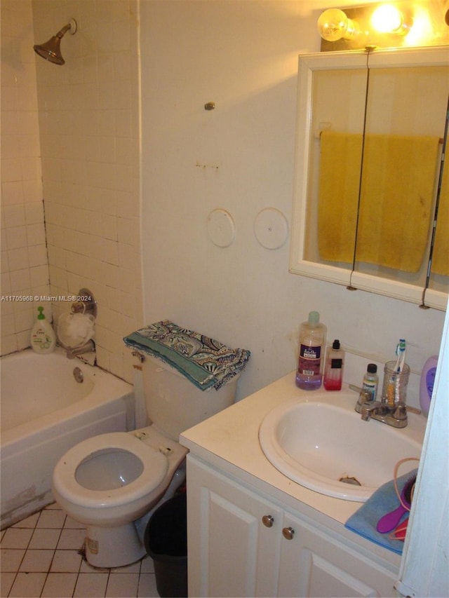 full bathroom featuring tile patterned floors, vanity, tiled shower / bath combo, and toilet