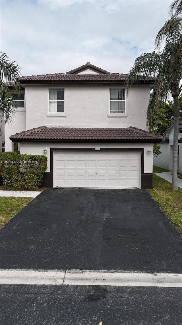 view of front of property with a garage