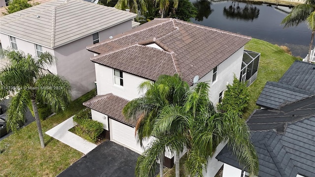 birds eye view of property with a water view