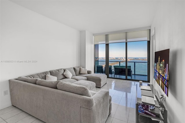 living room featuring expansive windows and light tile patterned flooring