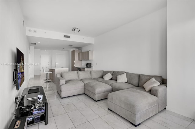 living room featuring light tile patterned flooring