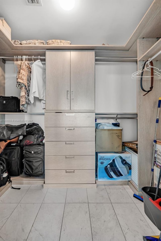 walk in closet featuring light tile patterned floors