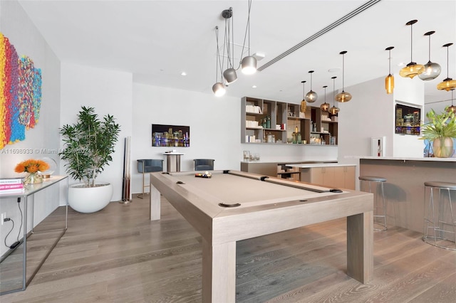 recreation room with hardwood / wood-style flooring and billiards