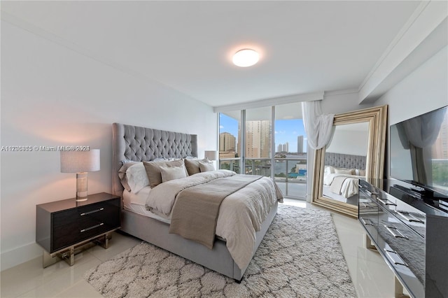 bedroom featuring light tile patterned floors, access to outside, and crown molding