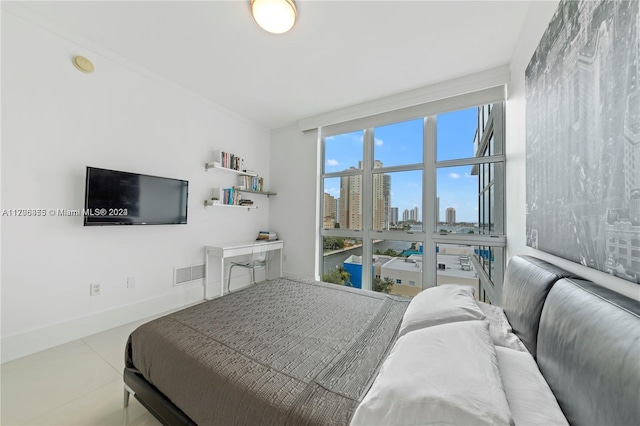 bedroom with tile patterned flooring and ornamental molding