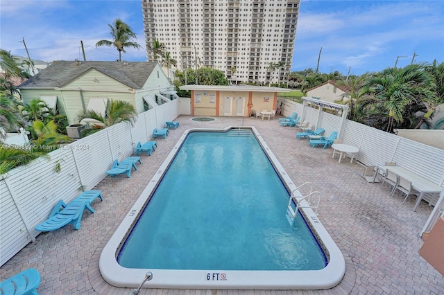 view of swimming pool with a patio area