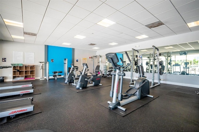 exercise room featuring a paneled ceiling