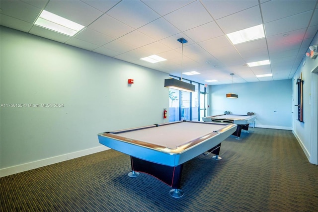 recreation room with a paneled ceiling, dark colored carpet, and billiards