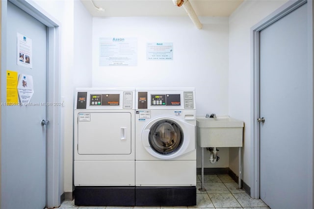 washroom featuring washer and dryer