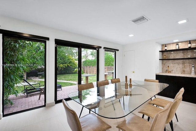 dining room featuring light tile patterned floors