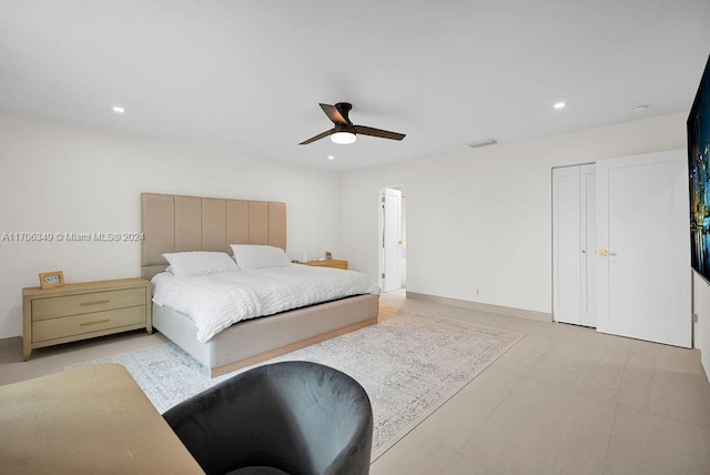 bedroom with ceiling fan and a closet