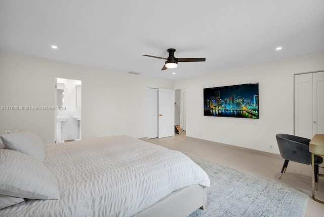 bedroom with connected bathroom and ceiling fan