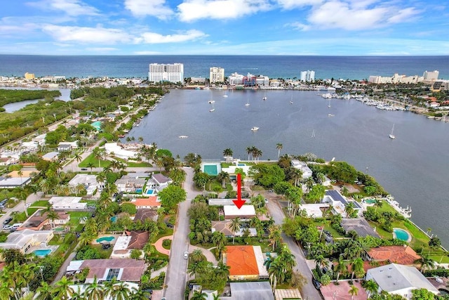 birds eye view of property with a water view