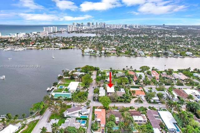 birds eye view of property featuring a water view