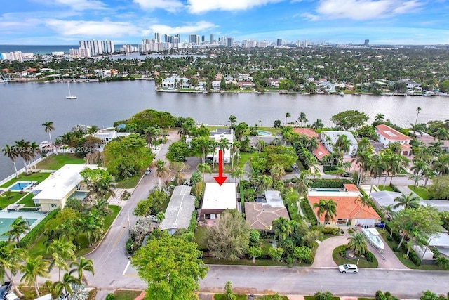 birds eye view of property with a water view