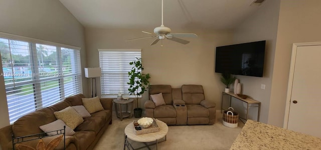 carpeted living room featuring ceiling fan and lofted ceiling