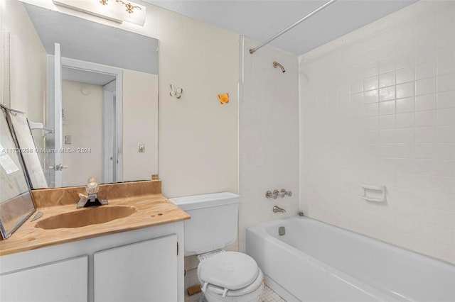 full bathroom featuring tile patterned floors, vanity, toilet, and tiled shower / bath combo