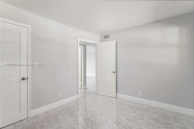 unfurnished bedroom featuring a closet