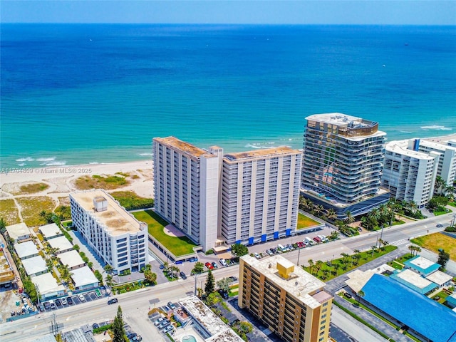 aerial view with a beach view and a water view