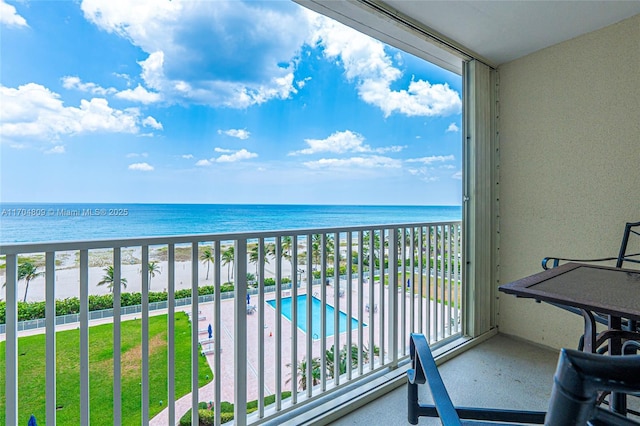 balcony with a view of the beach and a water view