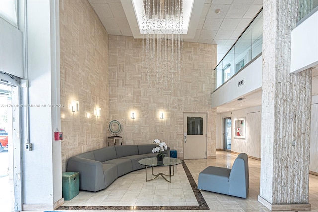 living room with a high ceiling