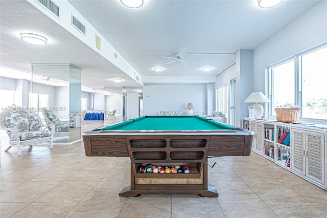 recreation room featuring light tile patterned floors, billiards, visible vents, ceiling fan, and a textured ceiling