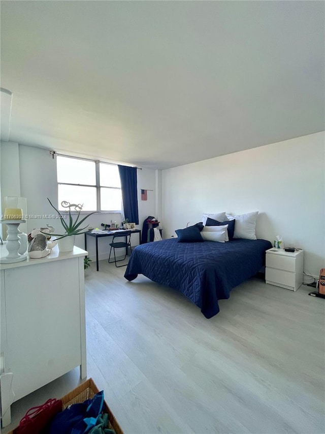 bedroom with light hardwood / wood-style floors