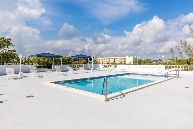 view of pool with a gazebo and a patio