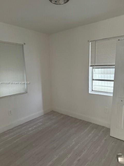 empty room featuring hardwood / wood-style floors