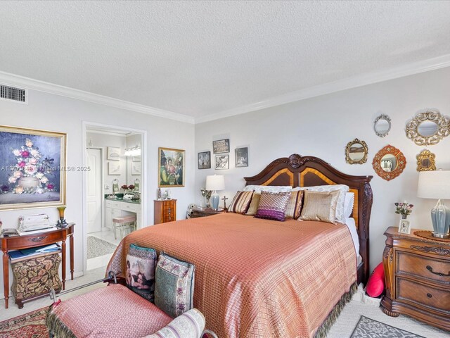 carpeted bedroom with ensuite bath, a textured ceiling, and ornamental molding