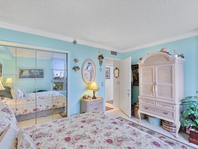 bedroom with a textured ceiling, a closet, and ornamental molding