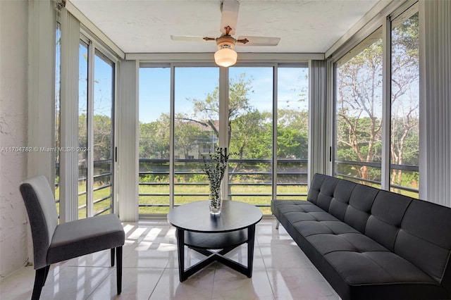 sunroom / solarium with plenty of natural light and ceiling fan