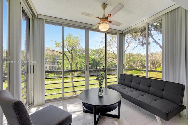 sunroom with ceiling fan