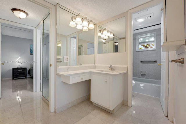 bathroom featuring vanity,  shower combination, and a textured ceiling