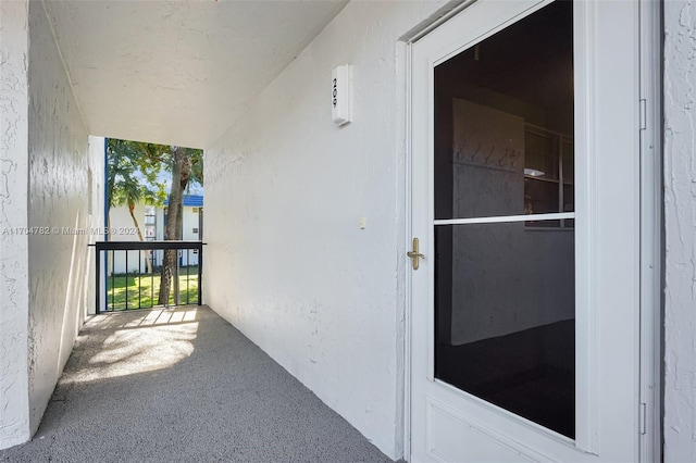 entrance to property with a balcony