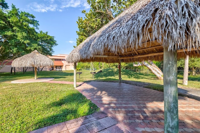 view of home's community with a gazebo and a lawn