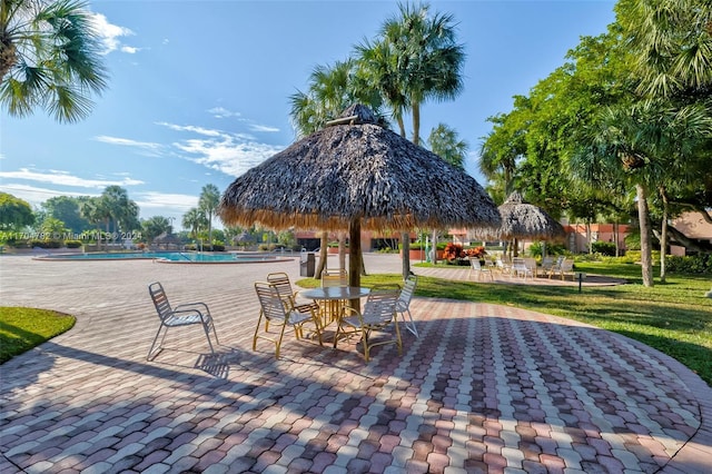 view of property's community with a gazebo, a patio area, and a swimming pool