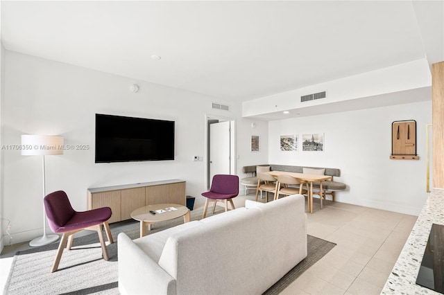 living room featuring light tile patterned flooring