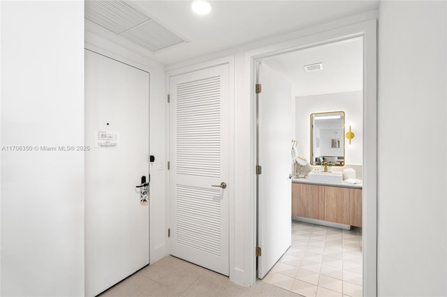 hall with light tile patterned flooring