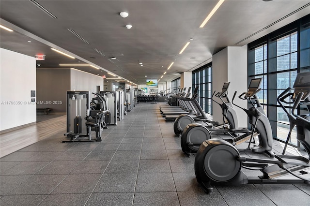 exercise room featuring floor to ceiling windows