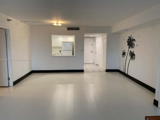 spare room with light wood-type flooring