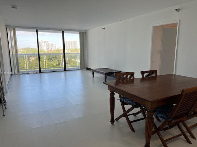 dining space featuring floor to ceiling windows