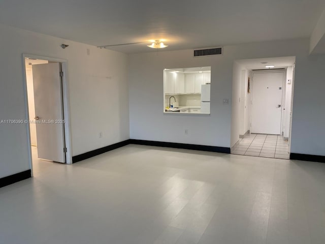 unfurnished room with sink