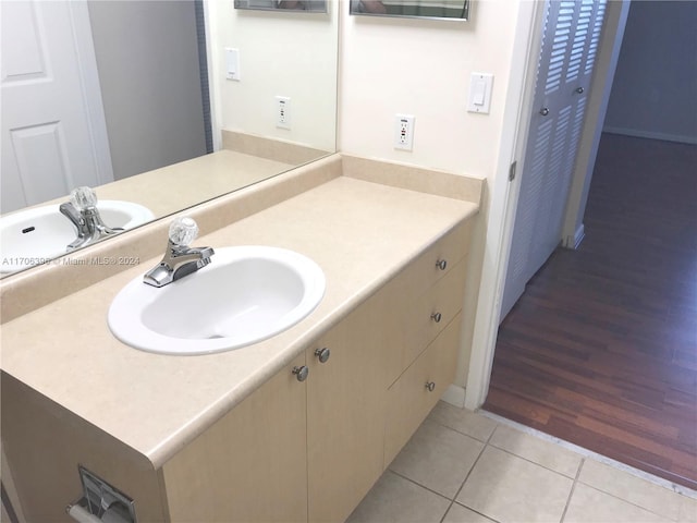 bathroom with hardwood / wood-style floors and vanity