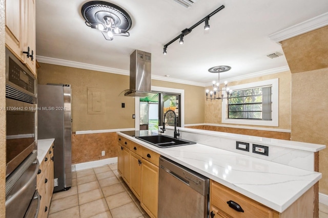 kitchen featuring sink, stainless steel appliances, island exhaust hood, track lighting, and a kitchen island with sink