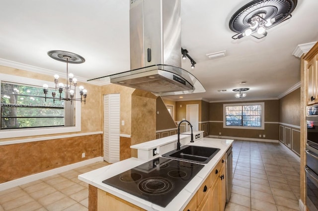 kitchen featuring light tile patterned flooring, appliances with stainless steel finishes, crown molding, and sink